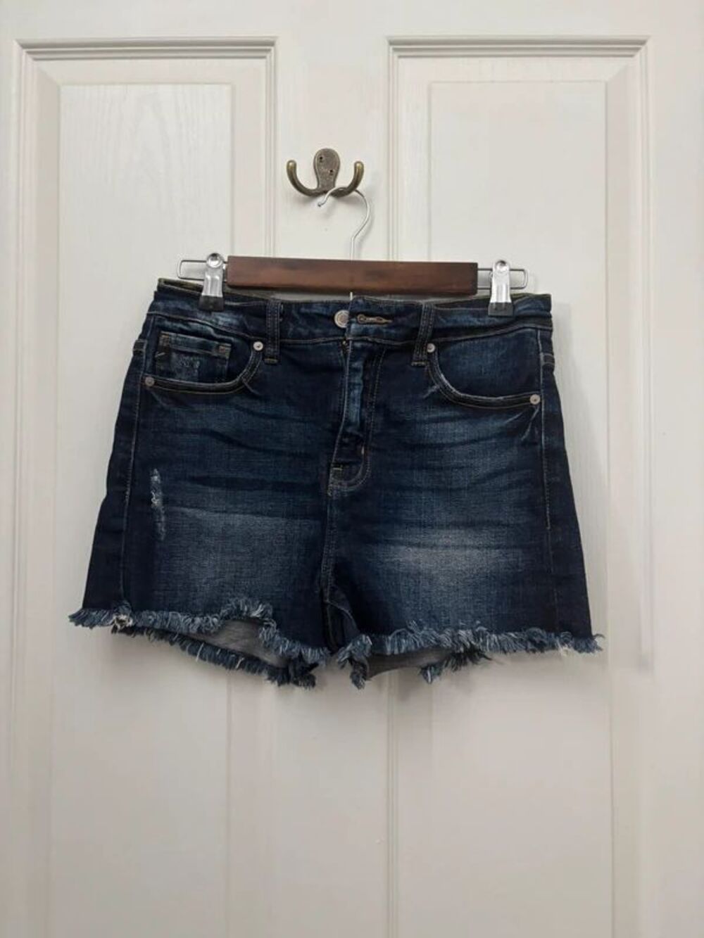KanCan Womenโs Medium Dark Wash High Rise Distressed Cutoff Denim Shorts